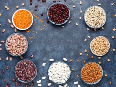 legumes-and-beans-assortment-in-different-bowls-on-light-stone-surface-top-view-healthy-vegan-protein-food